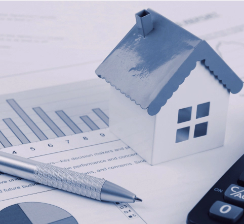 mini house scale model on top of documents tucson az